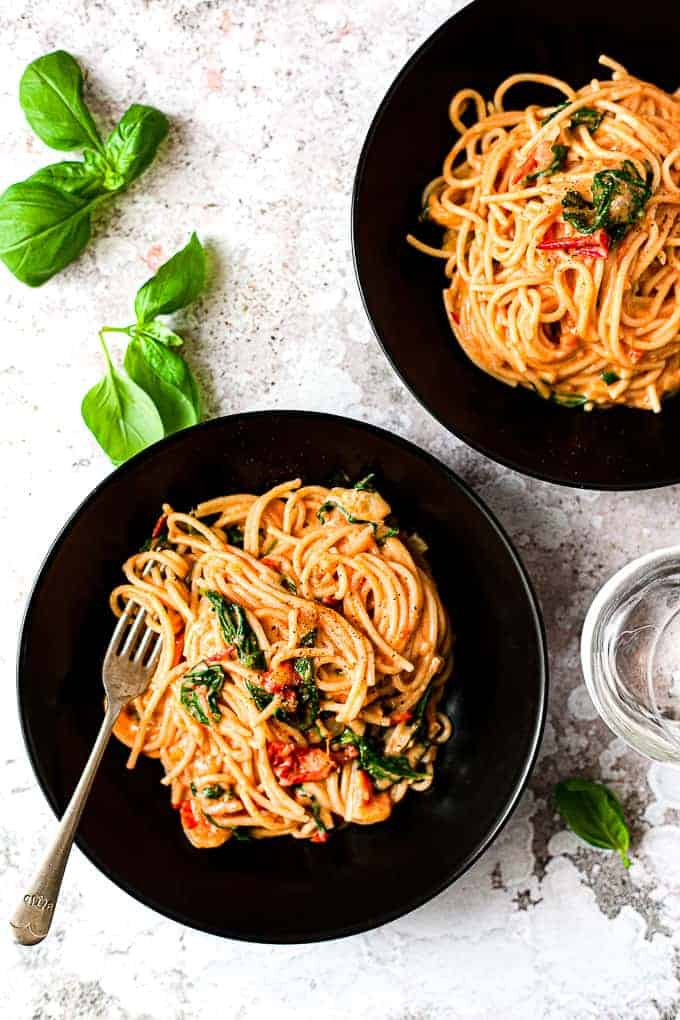 two bowls of creamy tomato pasta using Aldi ingredients.