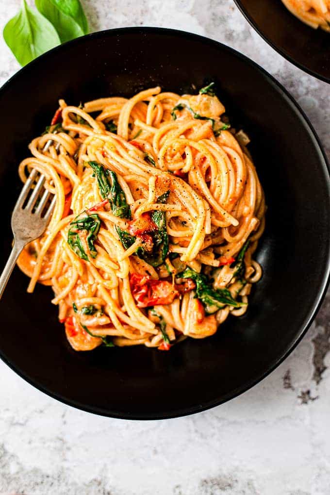 creamy tomato pasta in a bowl using Aldi ingredients.