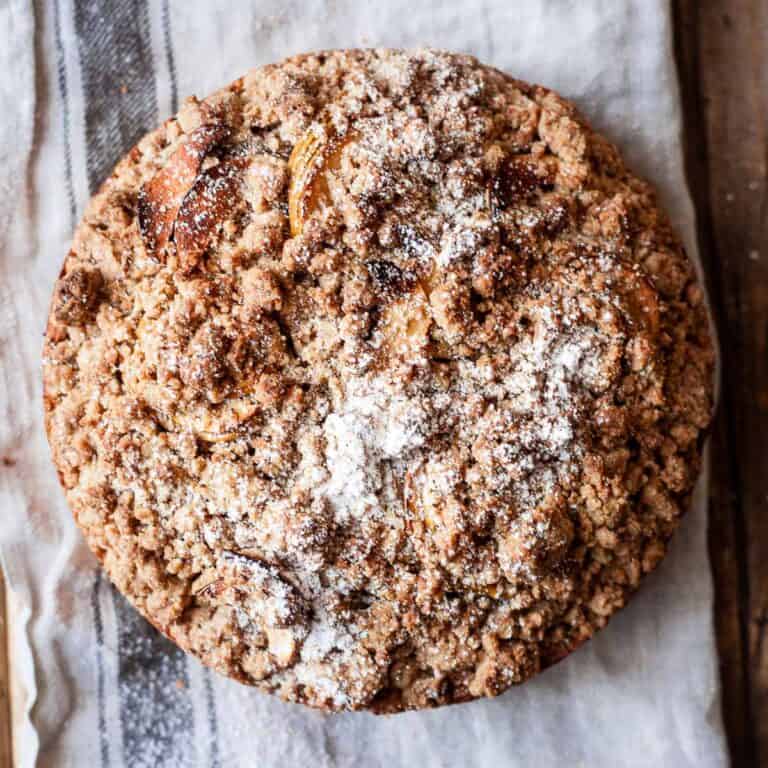 Apple crumble cake on a wooden board.