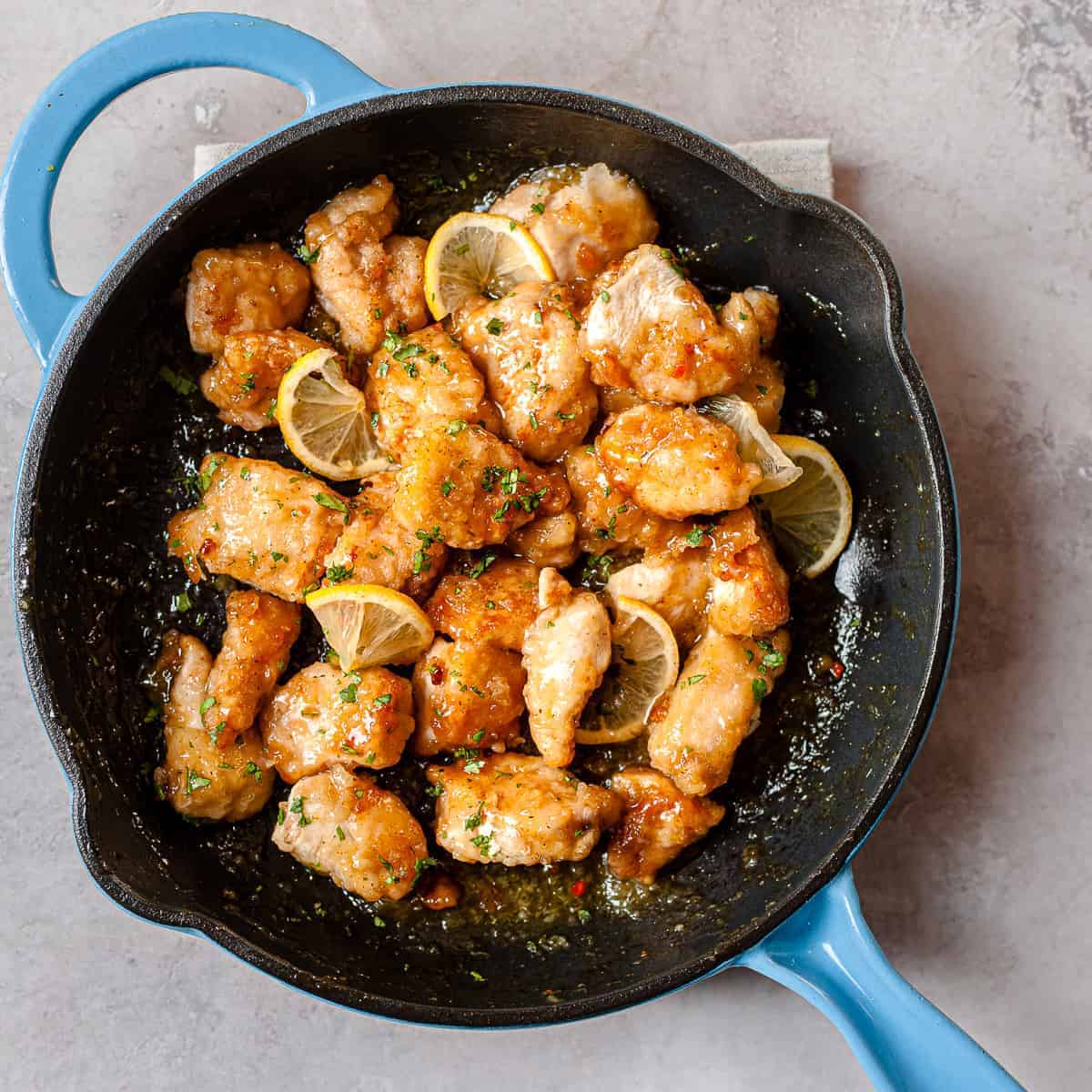 Crispy Chinese lemon chicken in a skillet. Made using only Aldi ingredients.