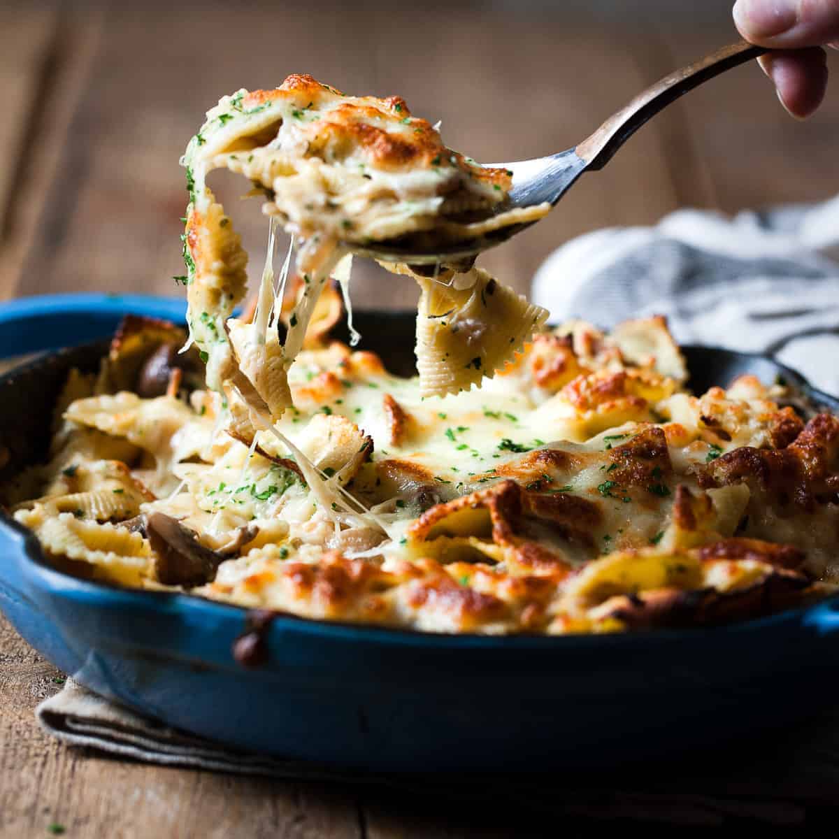Close up of melted cheese on top of vegetable pasta bake using Aldi ingredients.
