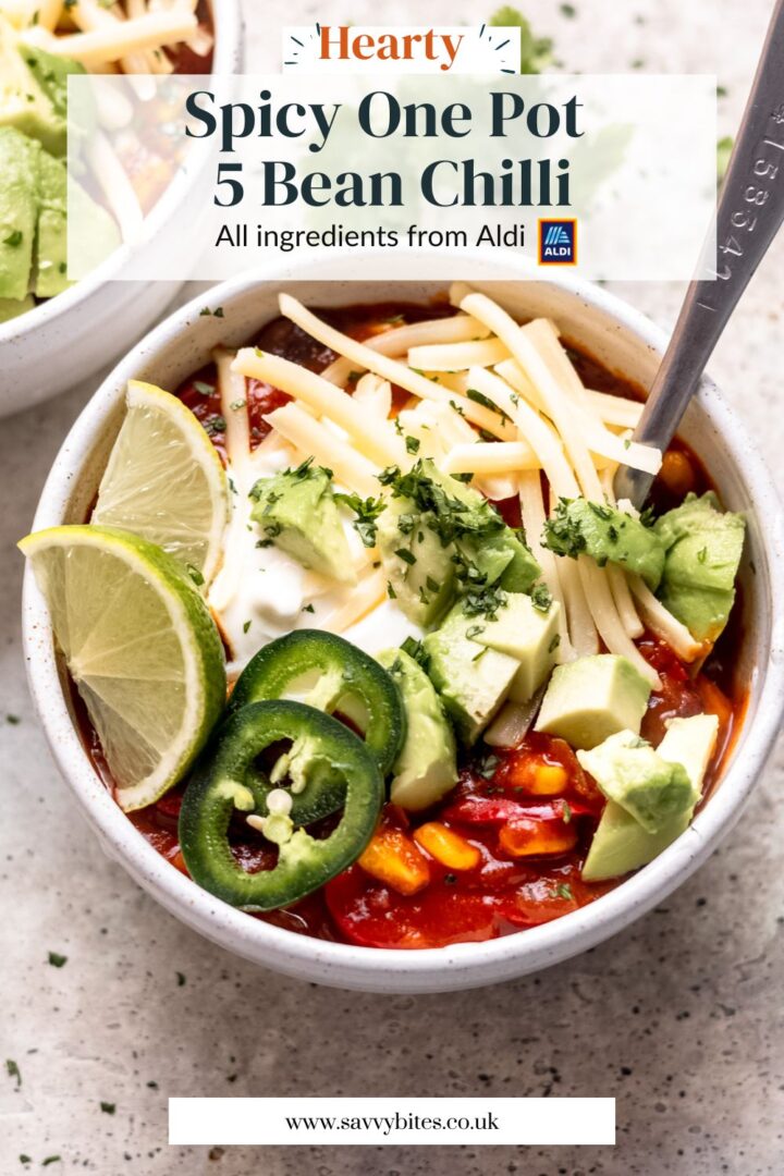 5 bean chilli in a bowl with cheese and avocado topping.