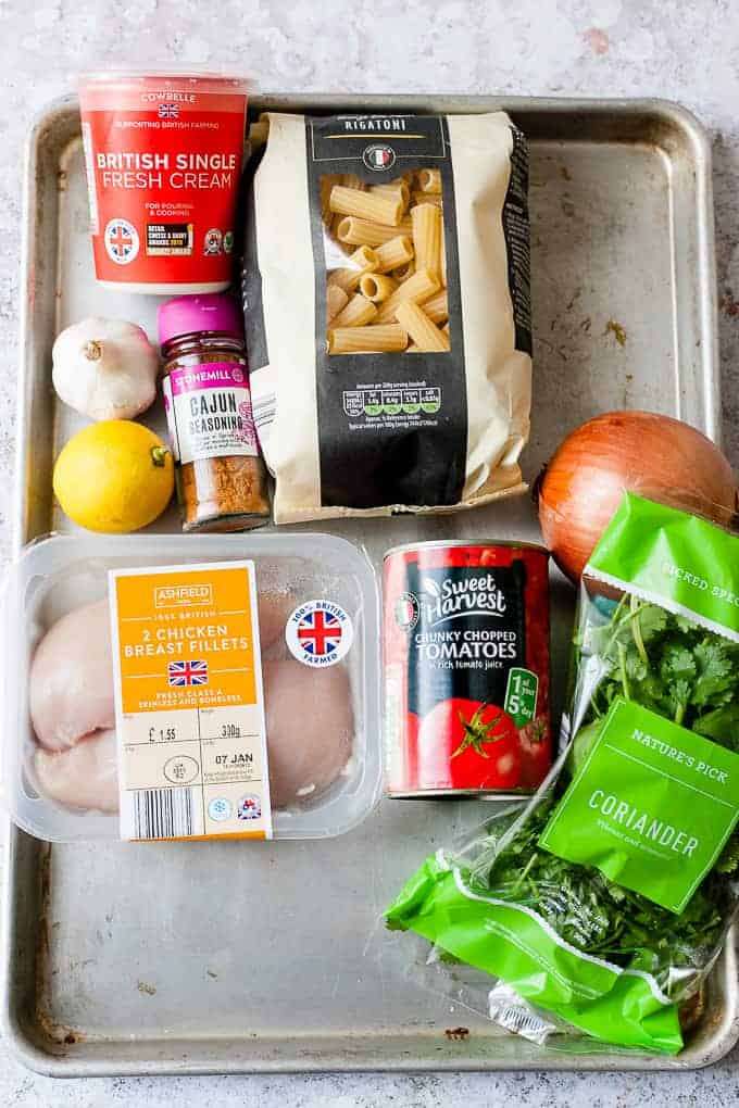 Ingredients from Aldi UK on a baking tray to make Cajun chicken pasta.