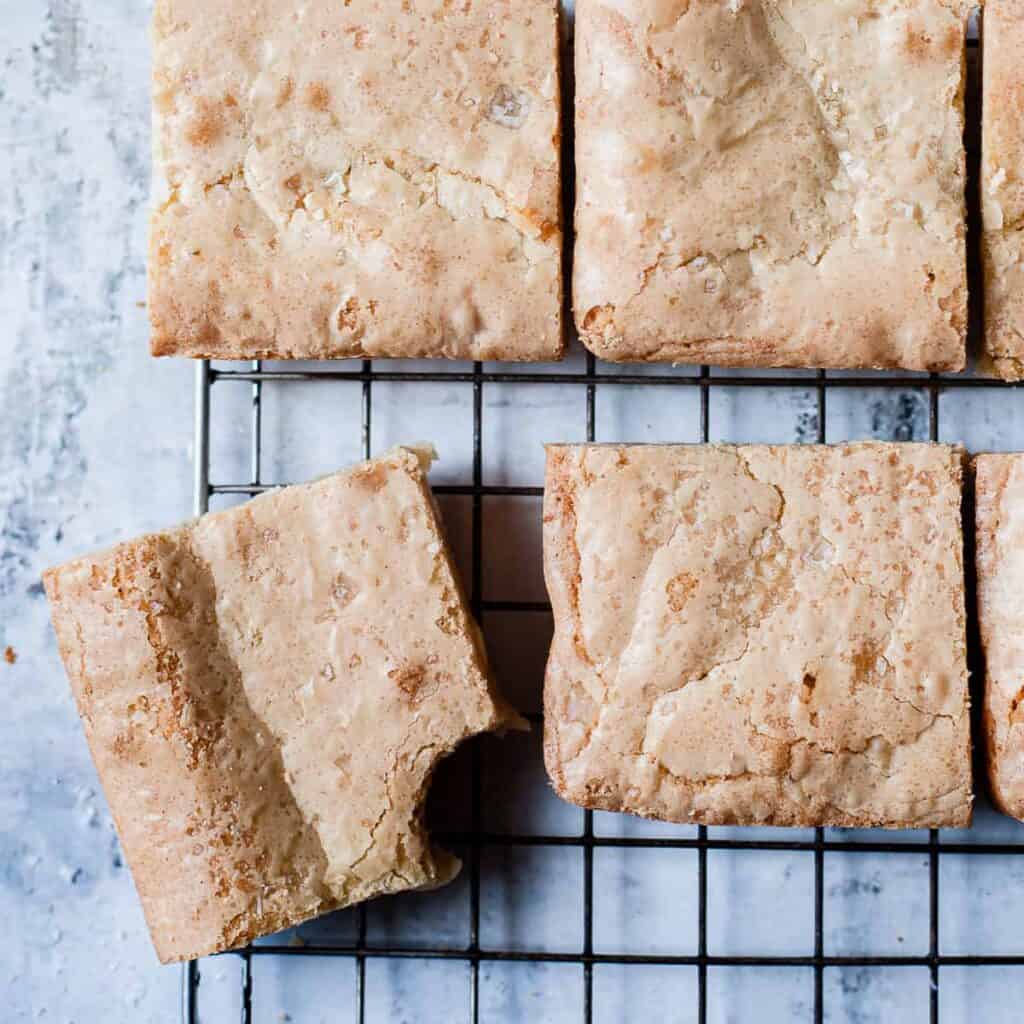 No fail white chocolate blondies on a cooling rack.