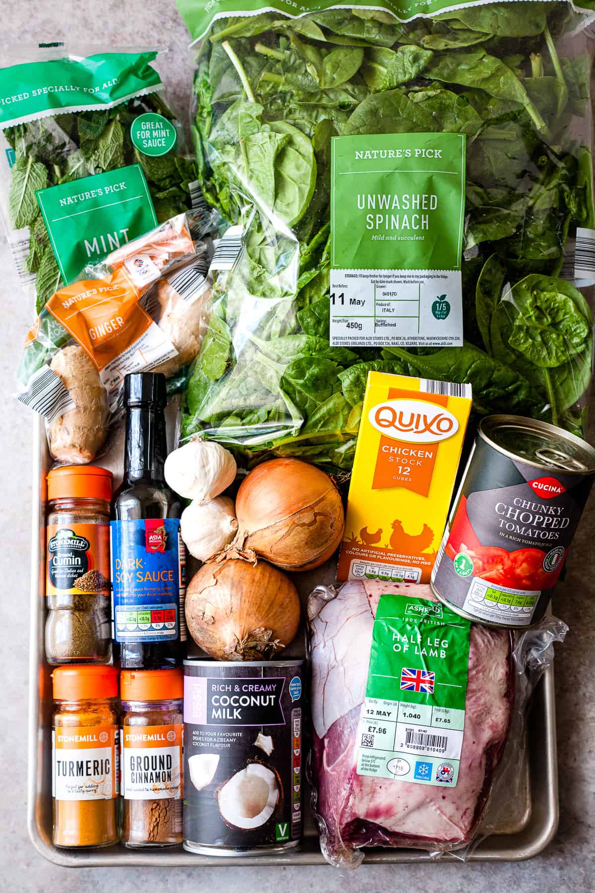 Ingredients for Indian lamb curry on a table.