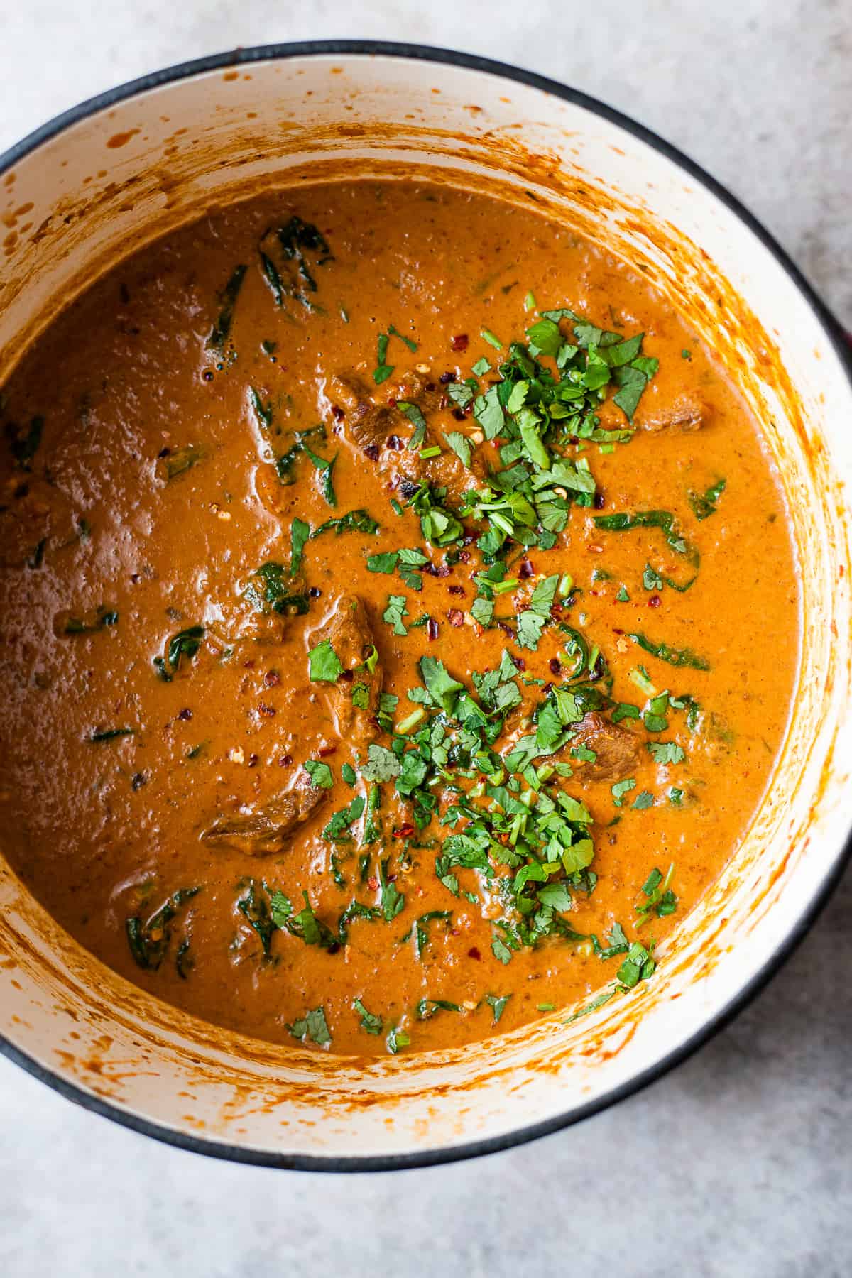 Rogan josh style Indian lamb curry in a pot.