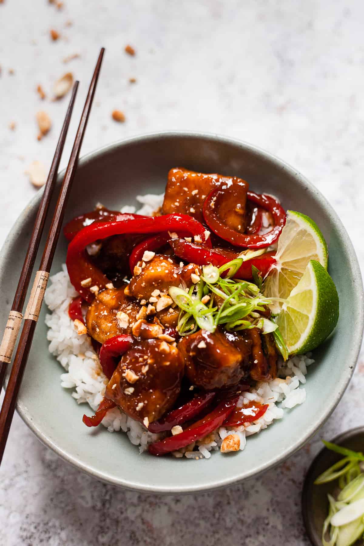 sticky Asian chicken in a blue bowl