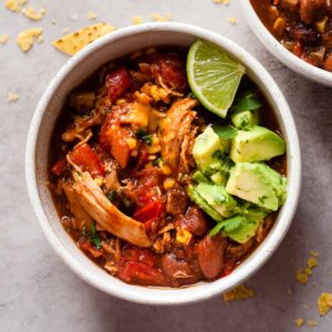 bowls of easy chicken chili on a white table