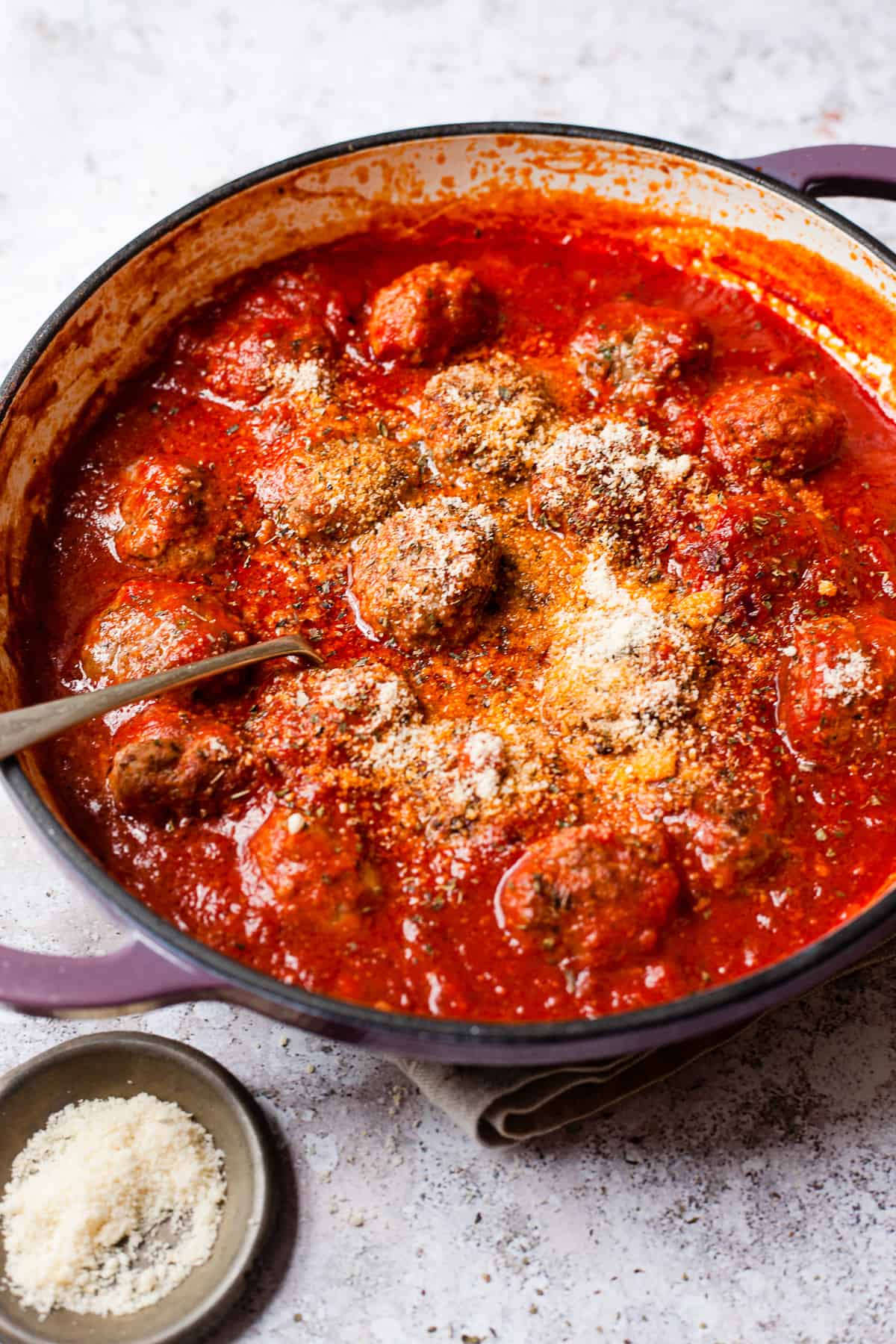 Meatballs in rich tomato sauce on a table