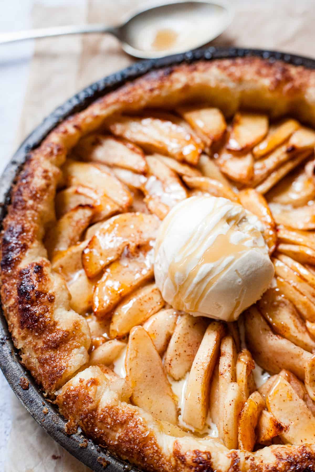 Close up of puff pastry apple tart with ice cream.