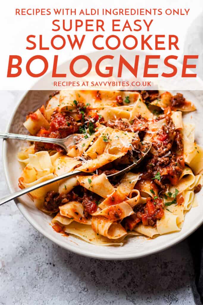 slow cooker bolognese in a white bowl with a fork. Text overlay.