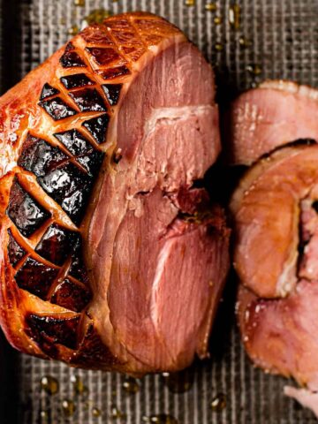 A gammon joint fresh from the slow cooker and glazed with honey.