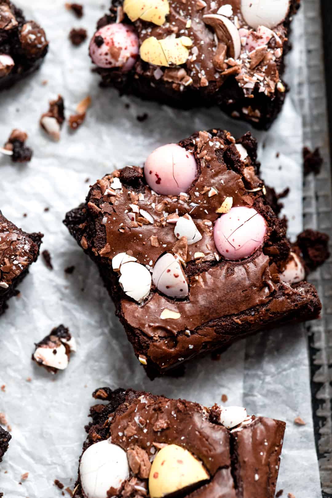 Mini egg brownies on a baking tray.