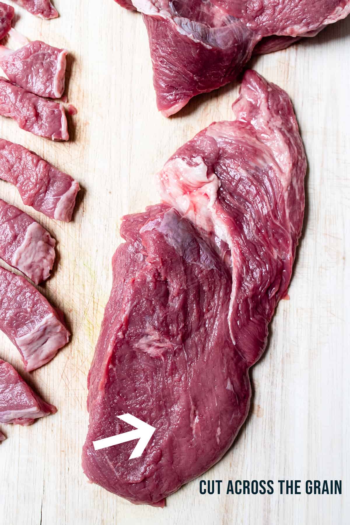 Beef being cut across the grain. Step 1 & 2 of stir fry making