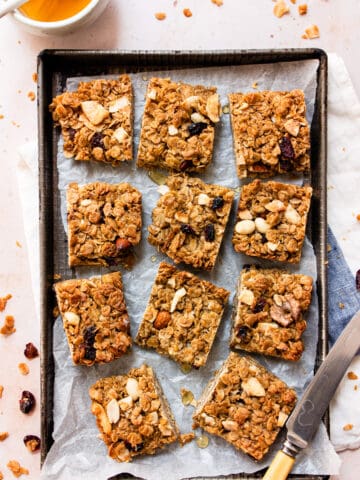 Healthy flapjacks on a baking tray with honey.