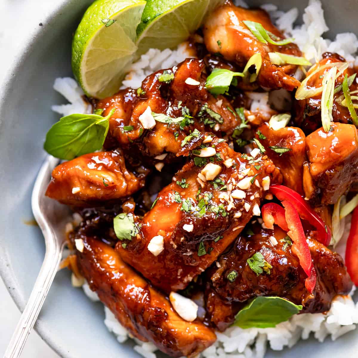 Crispy Chinese chilli chicken in a blue bowl.