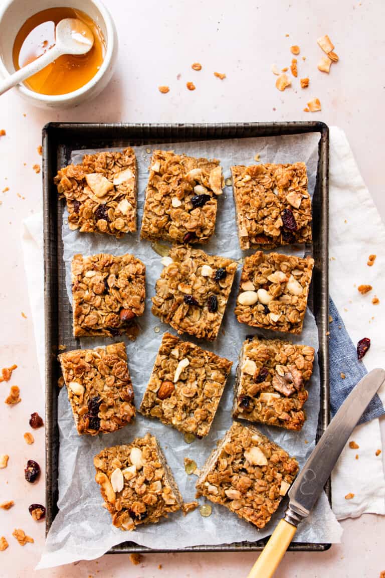 Soft and chewy flapjacks on a baking tray.