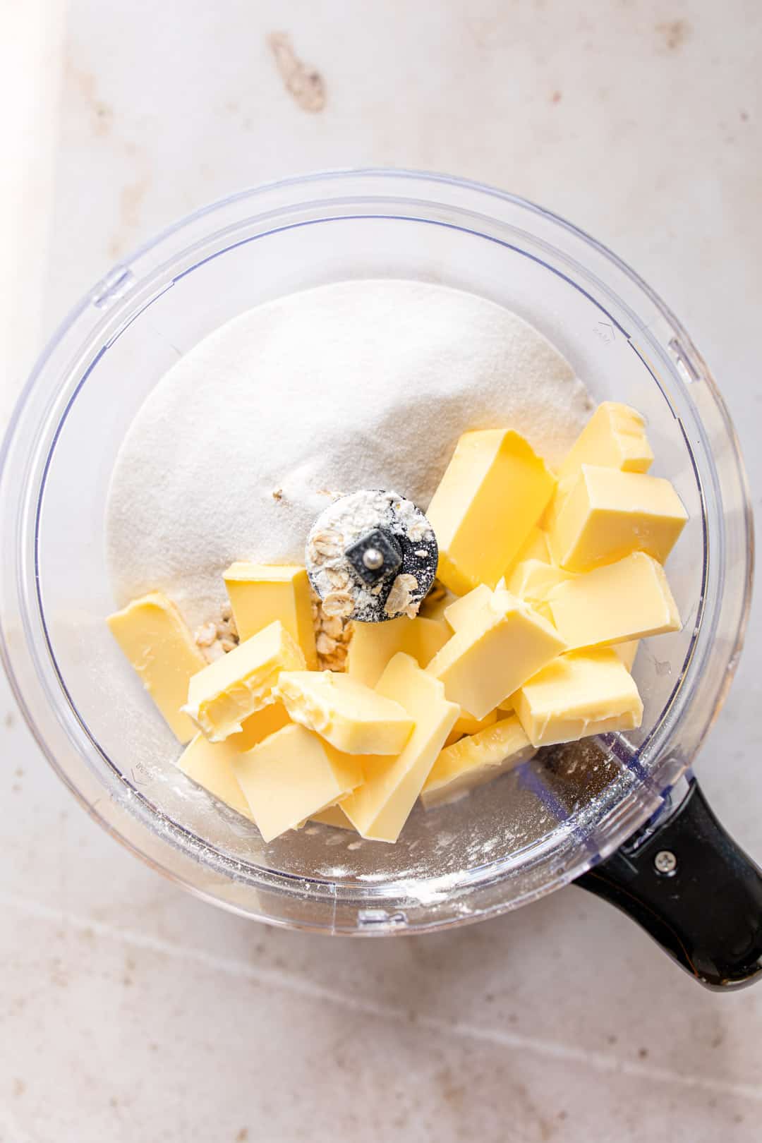 Ingredients for crumble topping in a food processor.