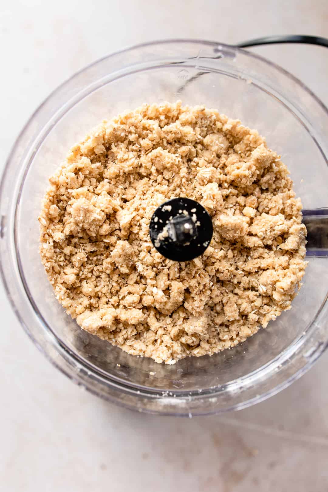 Crumble topping being mixed in a food processor.