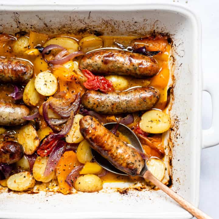 Sausage traybake with potatoes and vegetables.