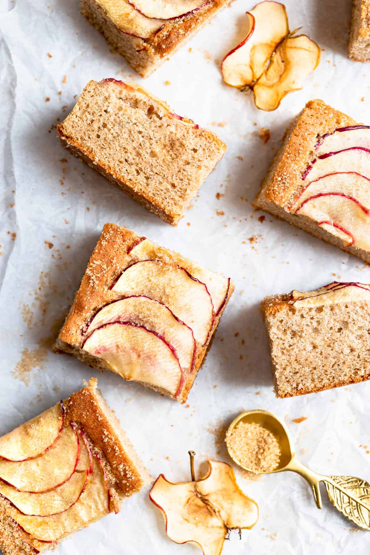 Apple traybake on a white paper with apples