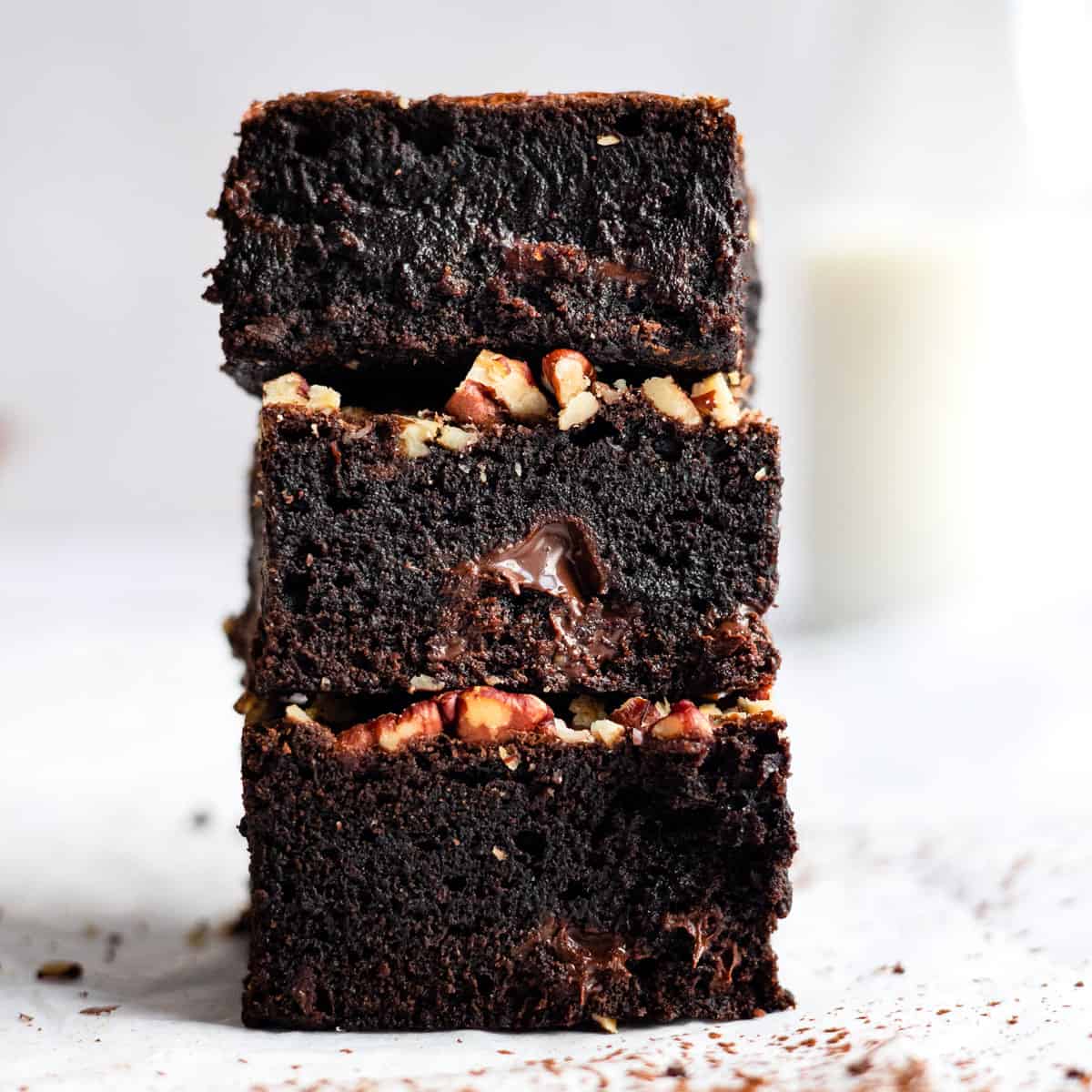 Rich and fudgy brownies stacked with some milk.