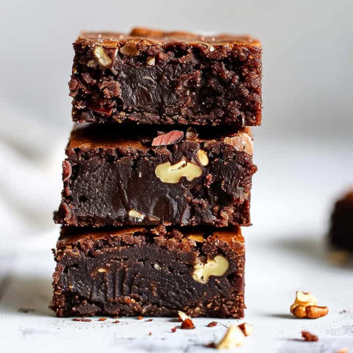 Easy pecan brownies on a white marble table.