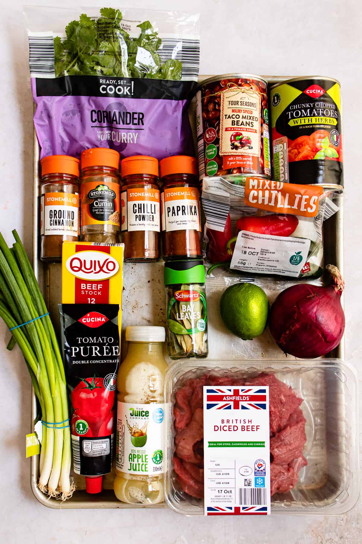 chilli ingredients all from Aldi. On a white table.