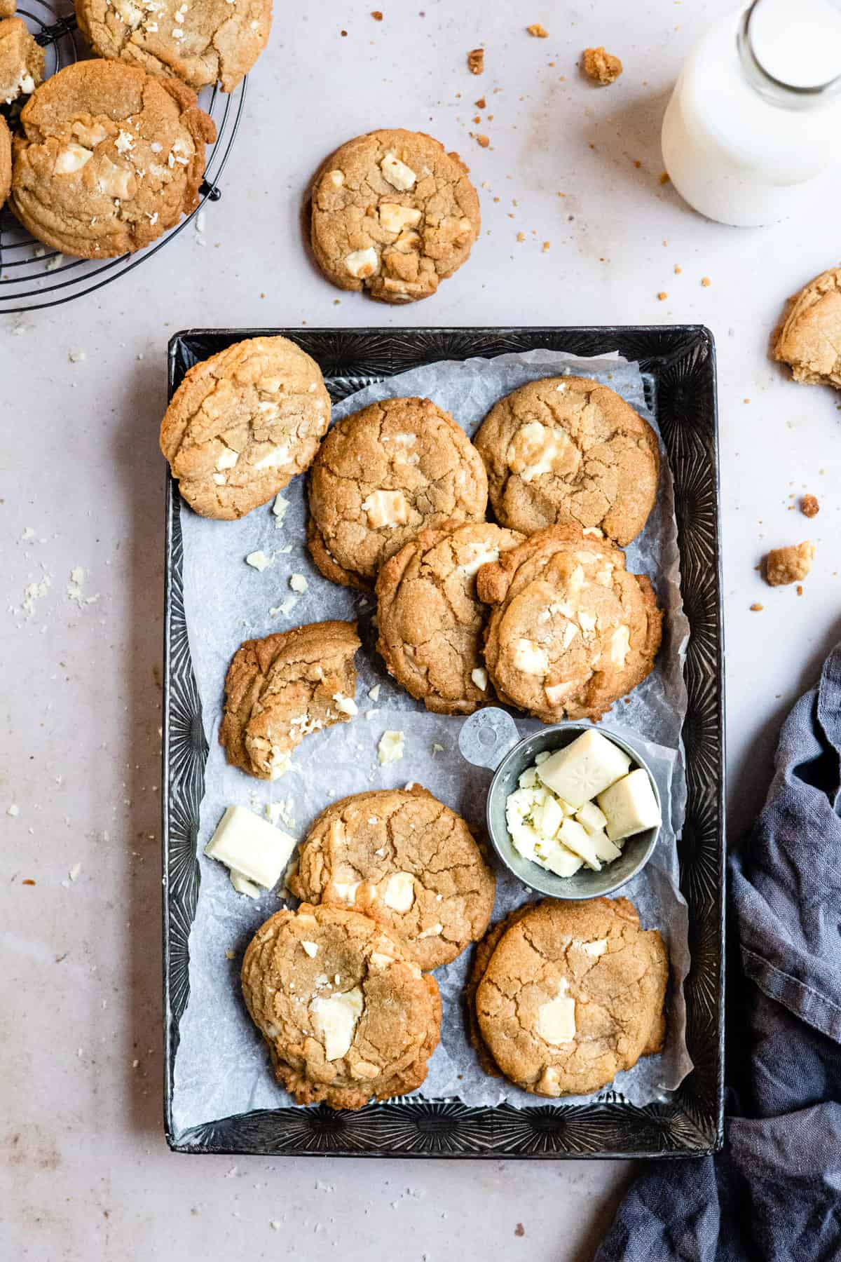 white chocolate chip cookies on a baking tray. 