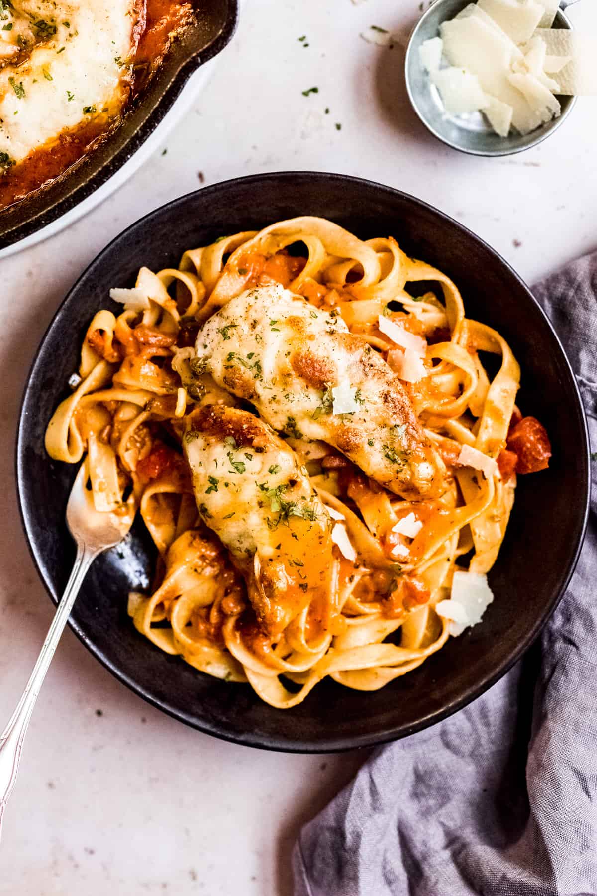 Chicken in tomato sauce on a bed of pasta