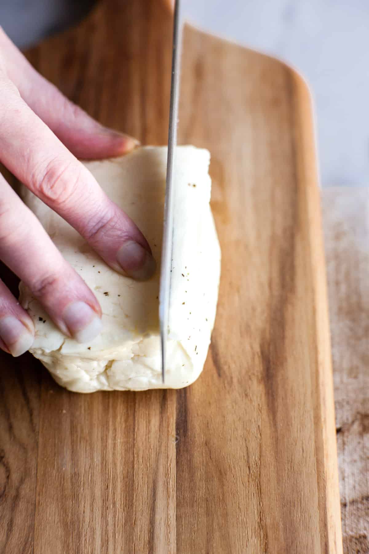 cheese being sliced for grilling