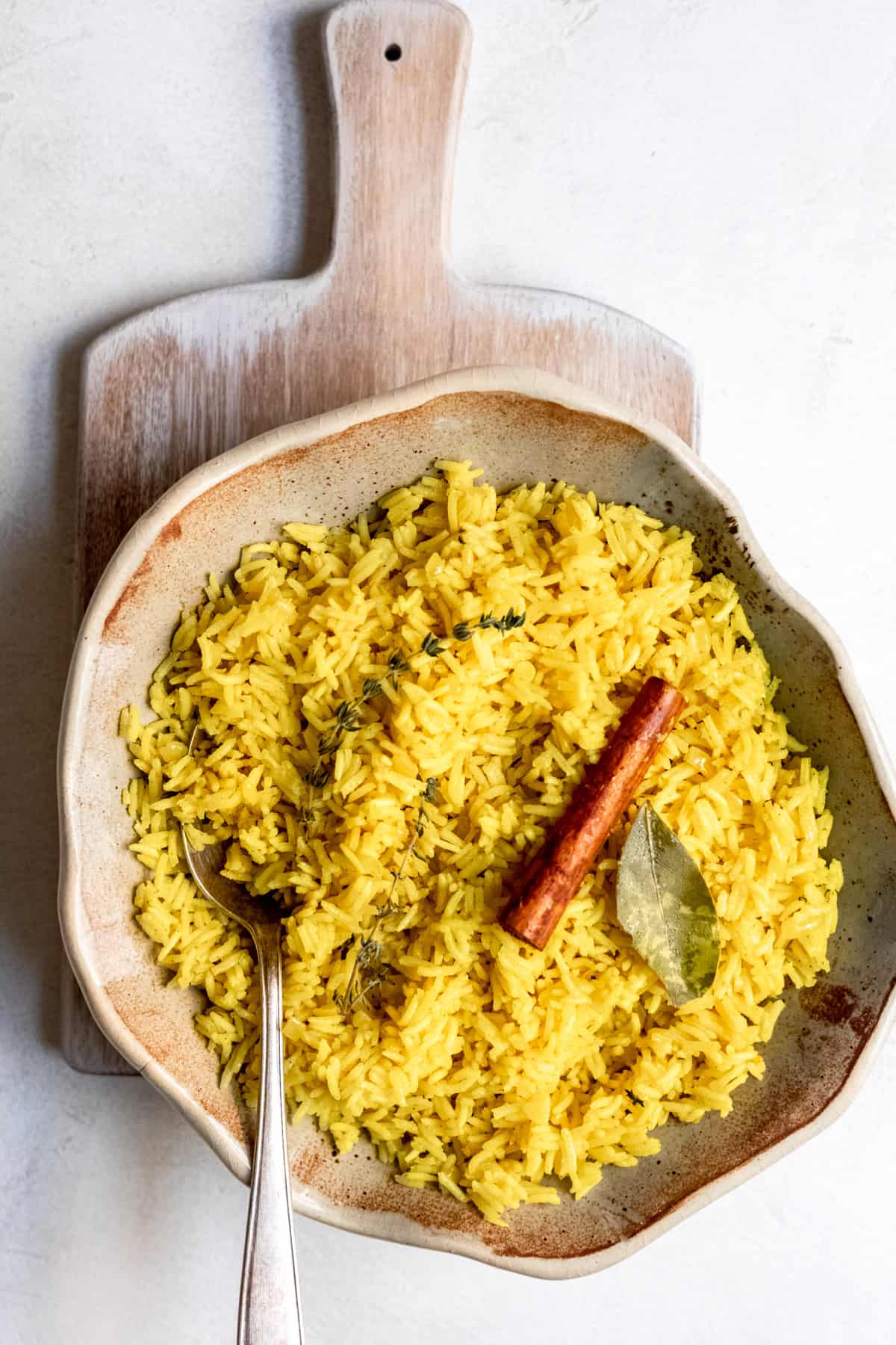 Golden pilau rice in a bowl.