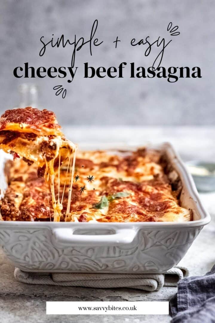 4 Layer easy beef lasagna in a white baking dish.