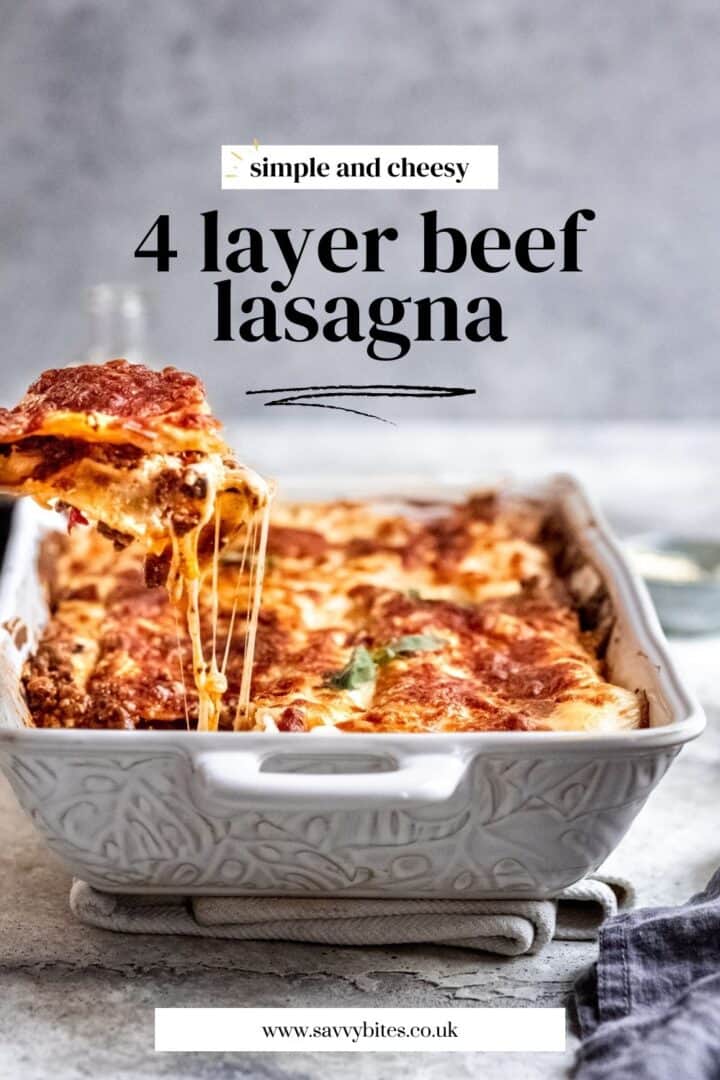 4 Layer easy beef lasagna in a white baking dish.