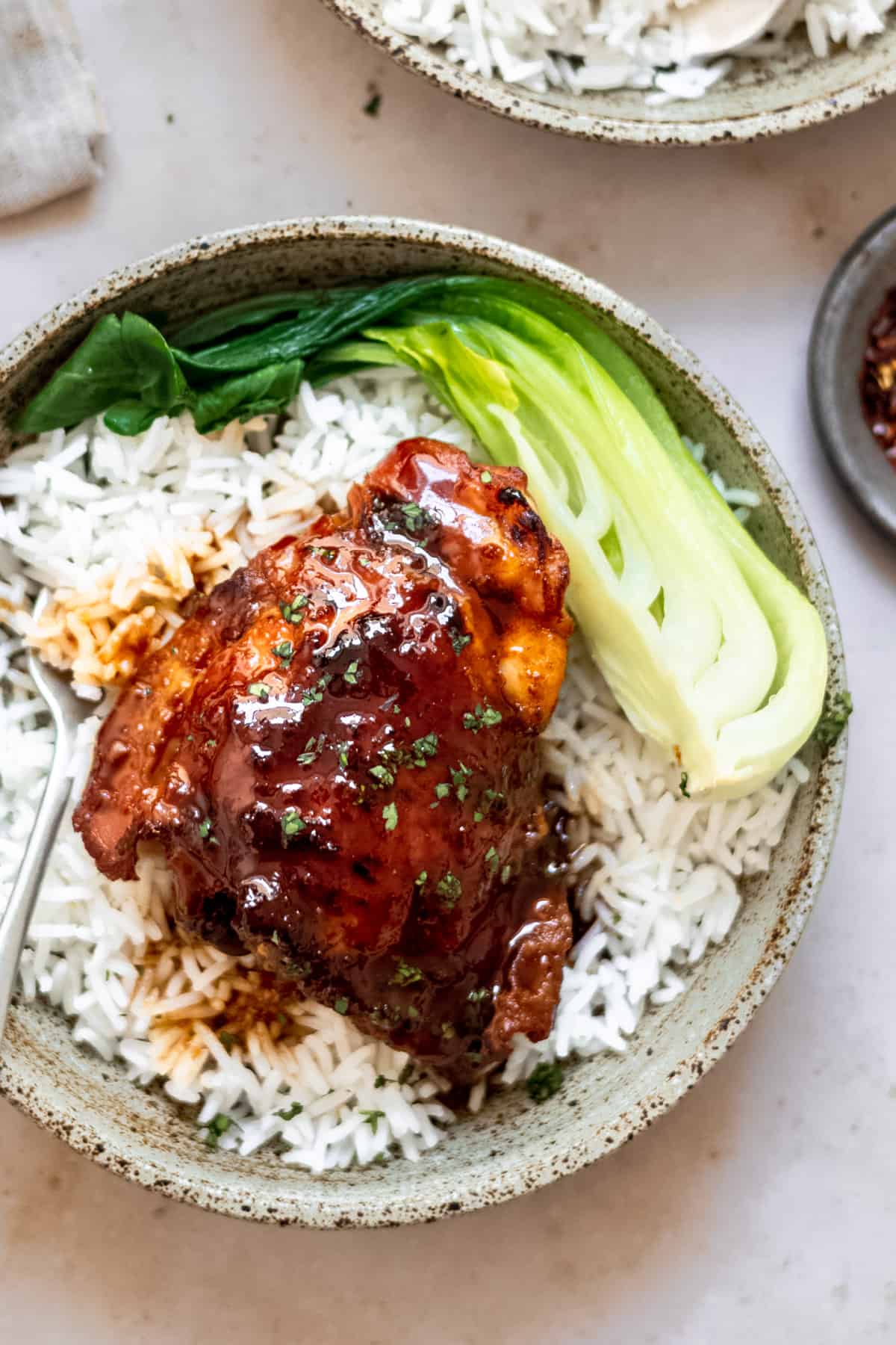 slow cooker chicken thighs on rice in a bowl