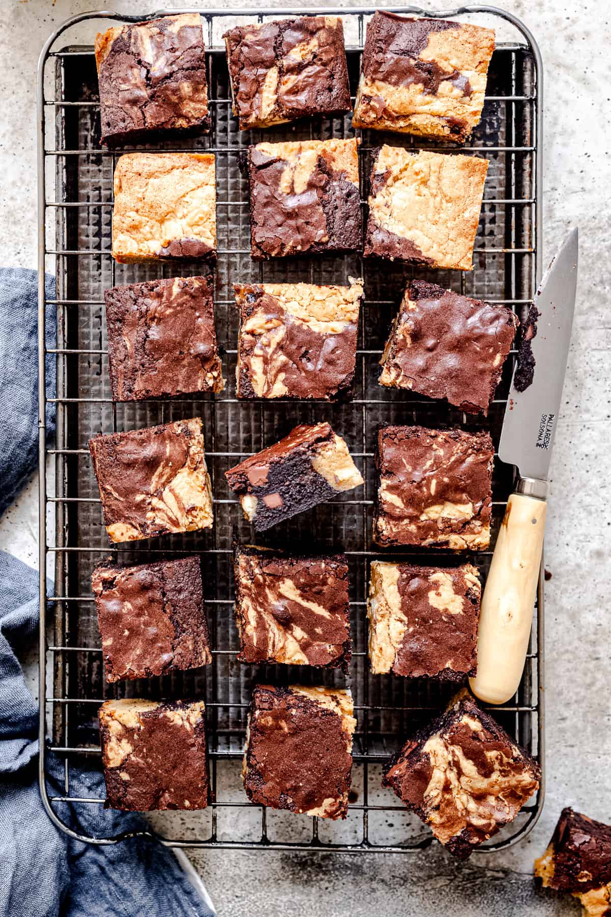 brownie blondies on a baking tray with a knife