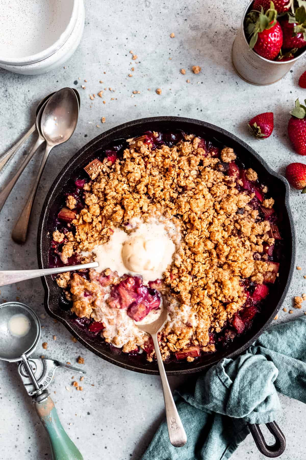 rhubarb and ginger crumble in a skillet with ice cream