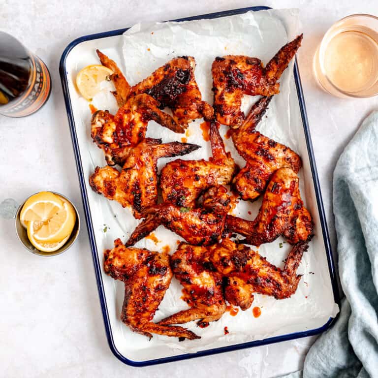 Nando's copycat peri peri chicken wings on a white tray.