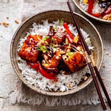Salmon stir fry on a bed of rice.