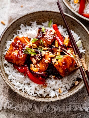 Salmon stir fry on a bed of rice.