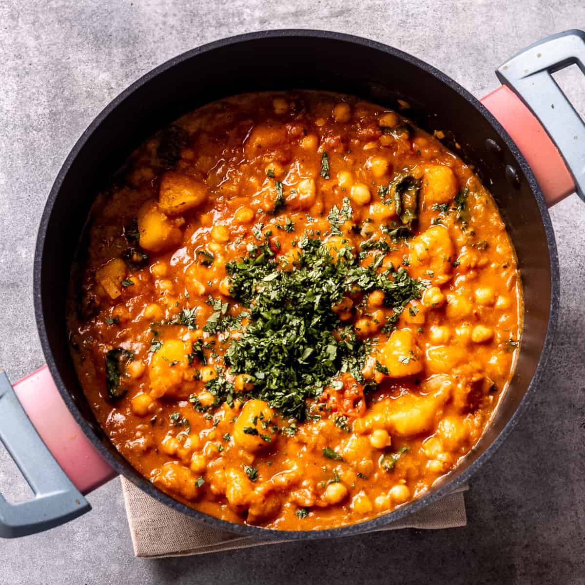 Butternut squash and chickpea curry with chopped coriander.