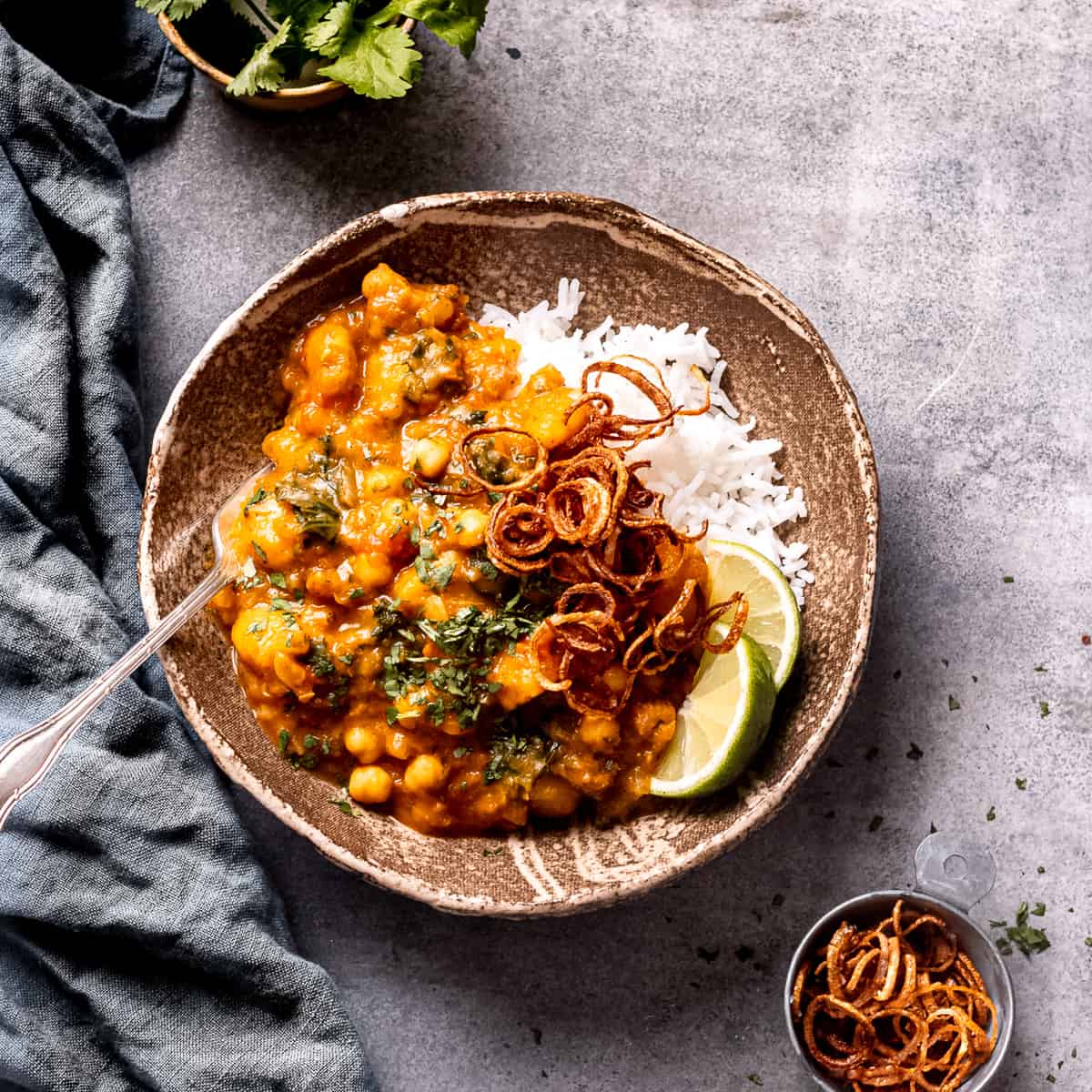 Butternut squash curry with white rice and crispy shallots.