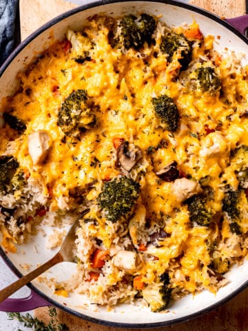 Cheddar topped chicken and broccoli casserole with cheese.