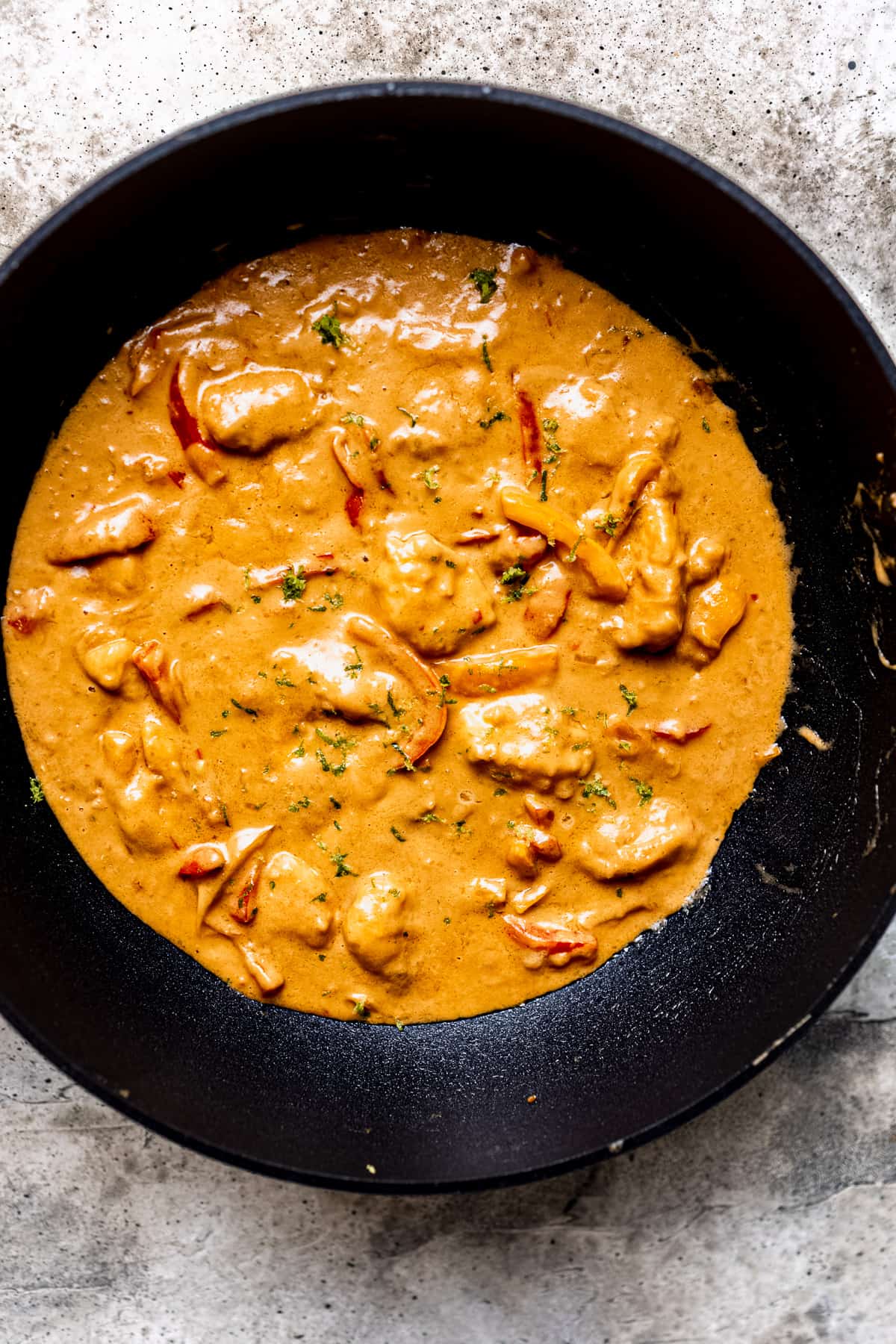 Peanut butter chicken in a non stick frying pan.