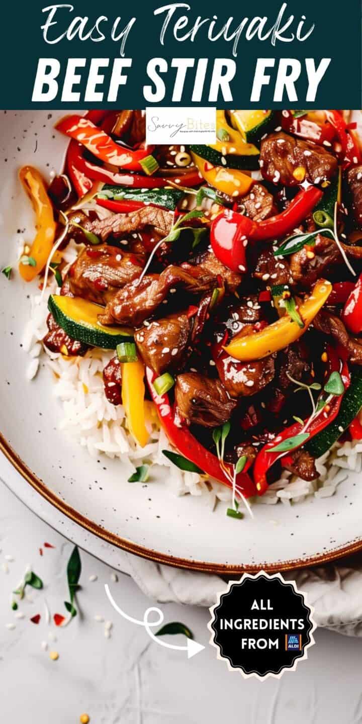 Beef stir fry with peppers over rice on a white plate.