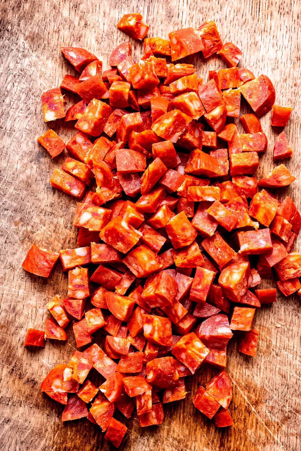 Chopped chorizo on a cutting board.