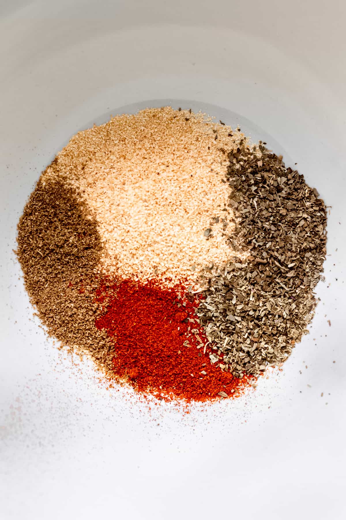 Spice rub in a white bowl.