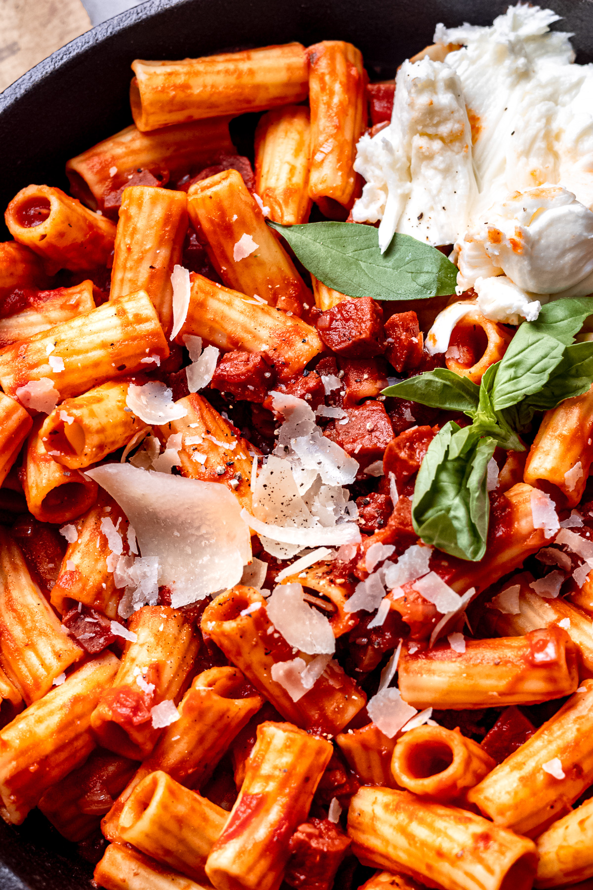 Chorizo rigatoni in a pan with mozzarella.