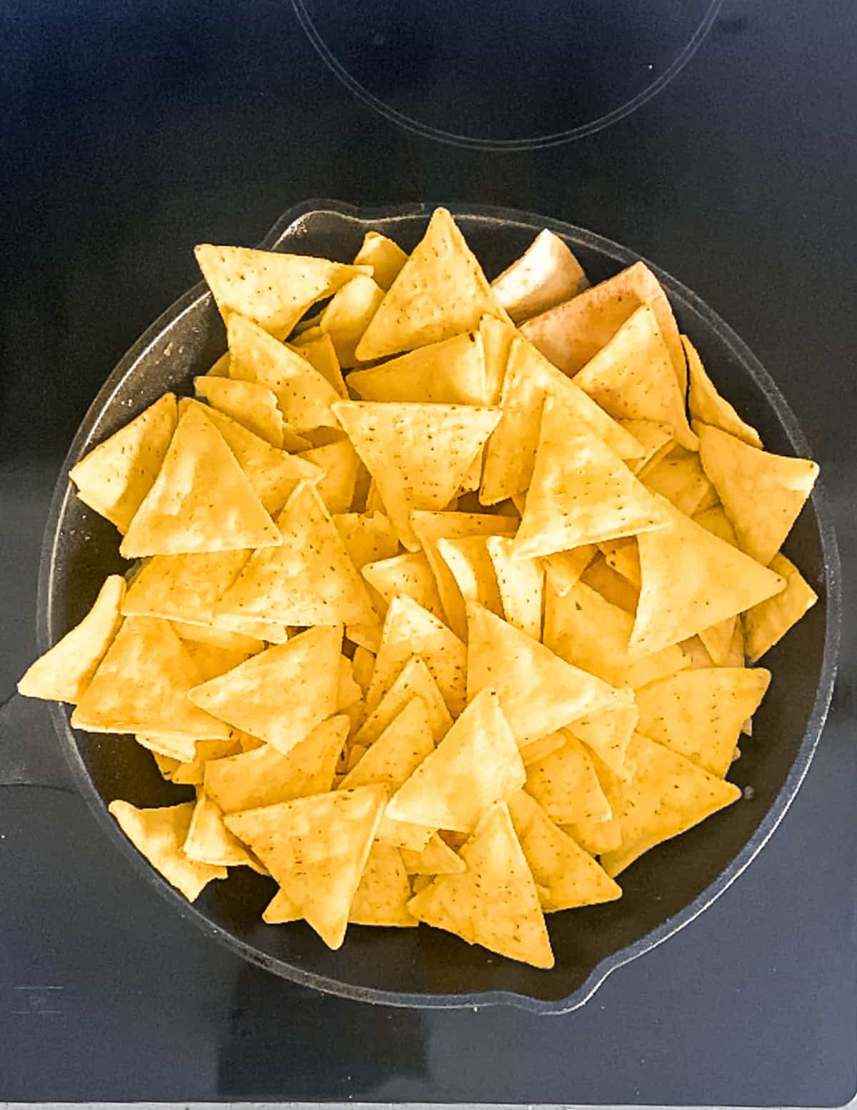 Tortilla chips in a skillet.