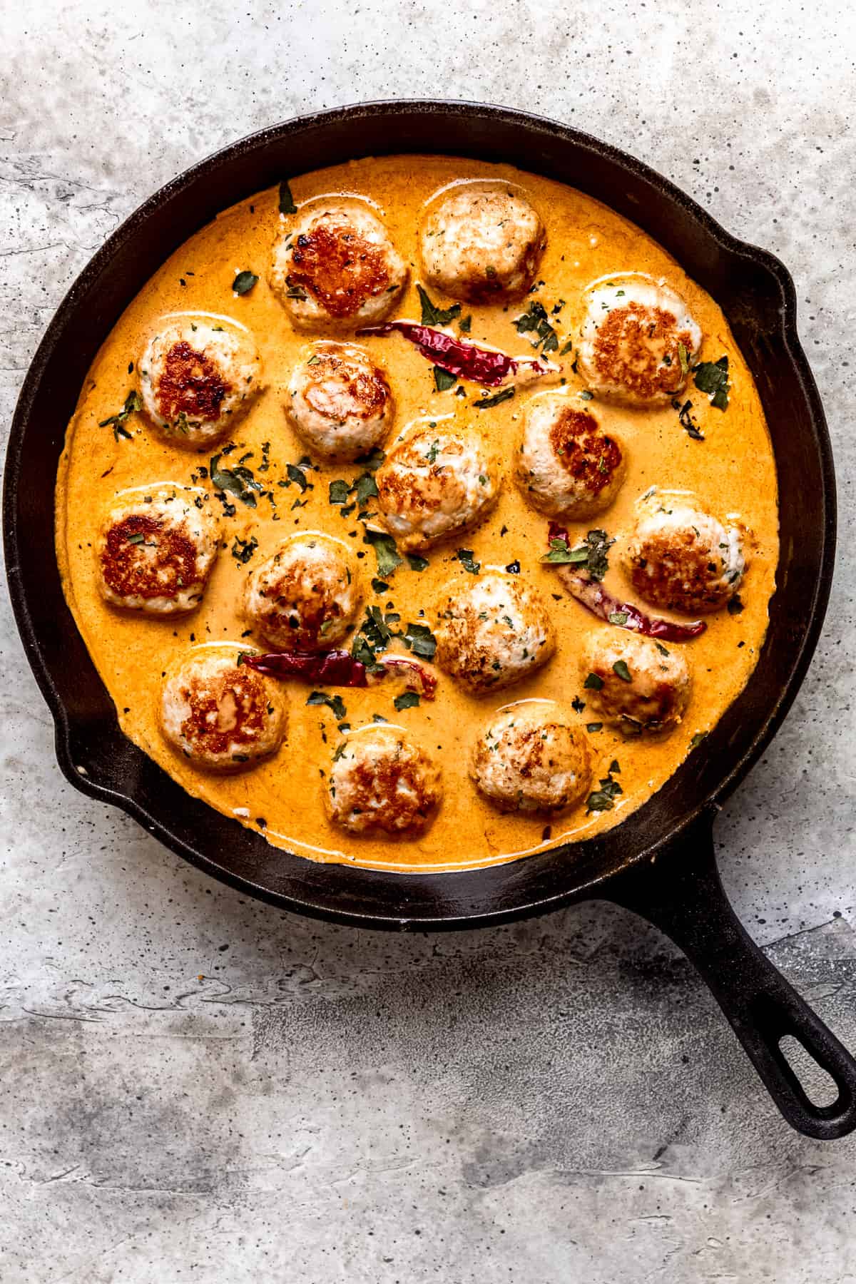 Turkey mince meatballs in a pan.